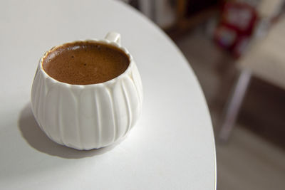 High angle view of coffee cup on table