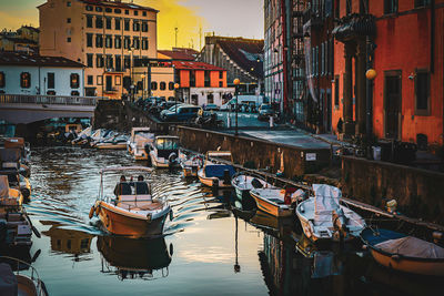 Boats moored at harbor