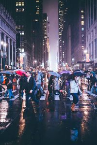 Crowd on wet road at night