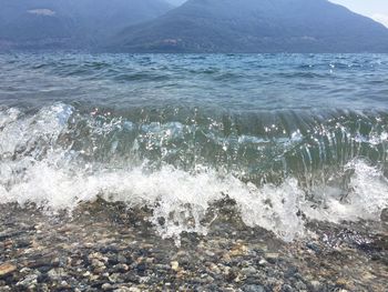 Scenic view of sea waves splashing on shore