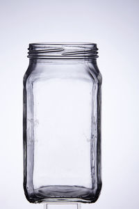 Close-up of jar over white background