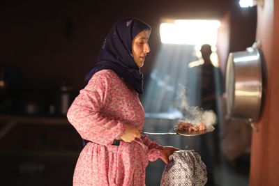 Midsection of woman holding food