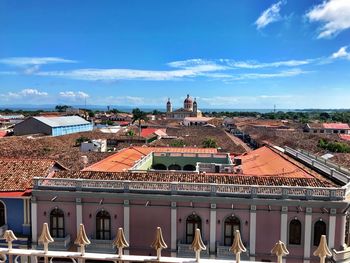 View of cityscape against blue sky