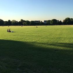 People relaxing on landscape