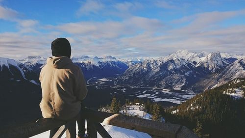 Tourists on snow covered mountain