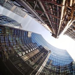 Low angle view of glass buildings in city