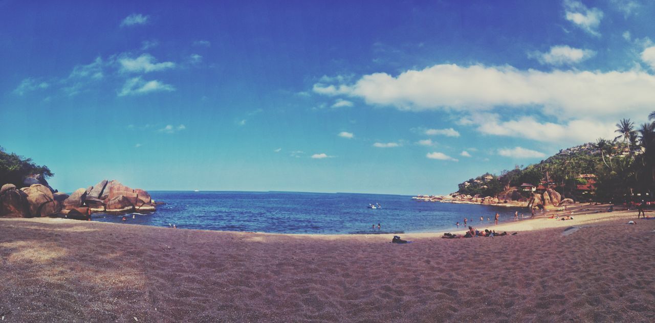 sea, beach, water, shore, horizon over water, sky, scenics, tranquil scene, beauty in nature, sand, tranquility, nature, blue, vacations, rock - object, coastline, incidental people, idyllic, rock formation