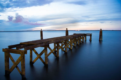 Pier on sea against sky