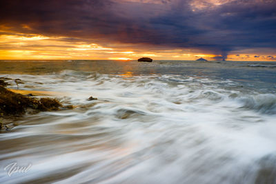 Scenic view of sea against sky during sunset