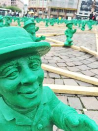 Close-up of painting on blue wall