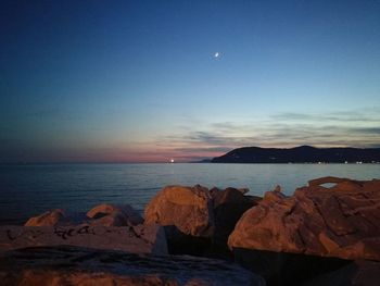 Scenic view of sea against clear sky