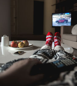 Low section of person relaxing at home