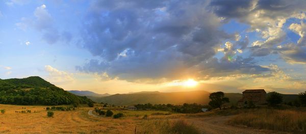 Scenic view of landscape at sunset