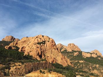 Scenic view of mountains against cloudy sky