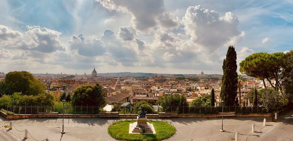 Panoramic view of townscape against cloudy sky