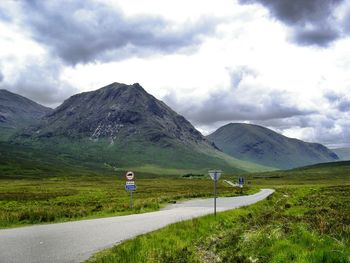 Scenic view of mountain road against sky