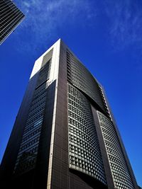 Low angle view of office building against clear sky