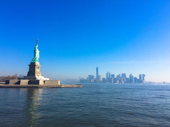 Statue of city at waterfront