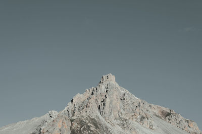 Low angle view of rock formation against clear sky