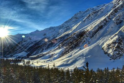 Scenic view of snow covered mountains