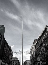 Low angle view of building against cloudy sky