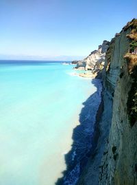 Scenic view of sea against clear blue sky