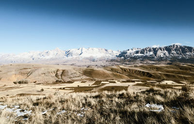 Scenic view of desert against clear sky