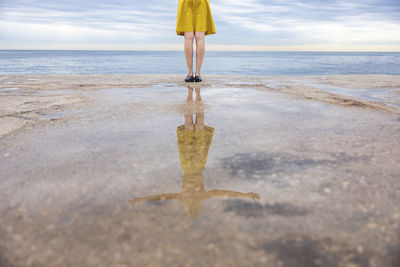 Woman with reflection on promenade