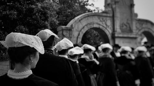 Rear view of people walking in park