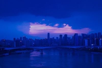 Scenic view of buildings against sky at dusk