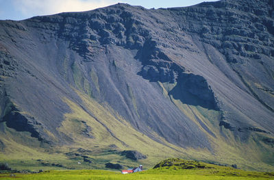 Little farm overshadowed by volcano crater