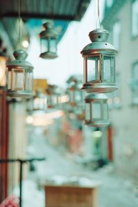 Close-up of lantern hanging in glass