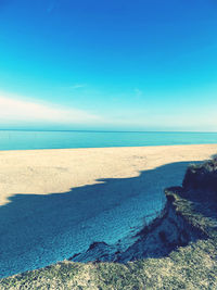 Scenic view of sea against blue sky