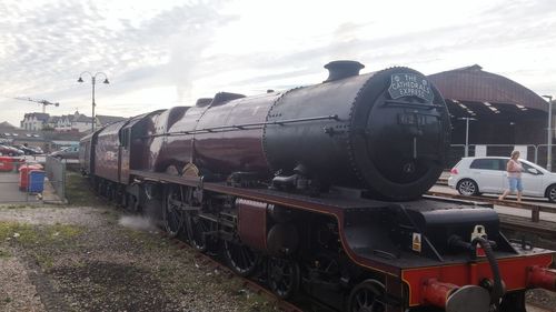 Train on railroad track against sky