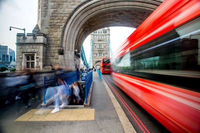 Blurred motion of bus on road in city