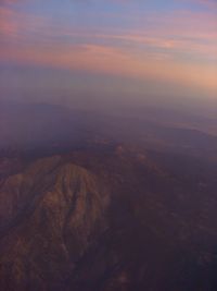 Aerial view of landscape against sky during sunset