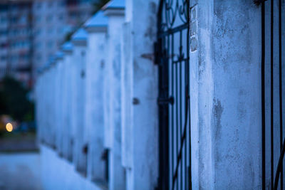 Black fence with white pillars