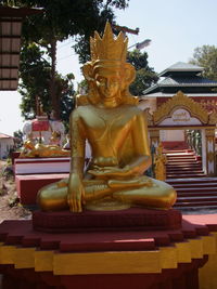 Statue against temple