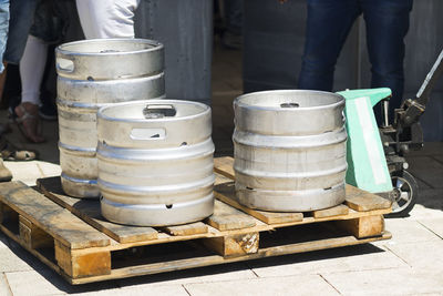 Beer metallic kegs in city street for delivering by delivery worker