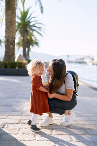 Rear view of mother and daughter