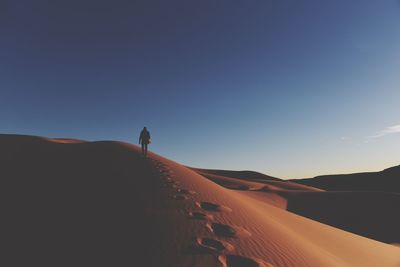 Scenic view of desert against clear sky