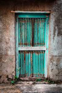 Blue closed door of old building