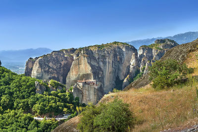 View of rocks with monastery of rousanou in meteora, greece