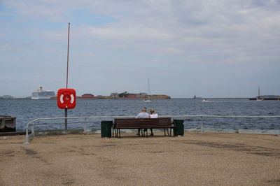 Boats in sea against sky