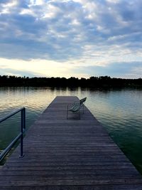 Pier over lake against sky