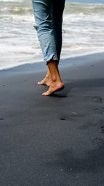 Low section of person on beach