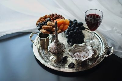 Close-up of fruits on glass table
