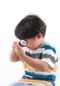 Boy looking at camera over white background