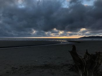 Scenic view of sea against storm clouds