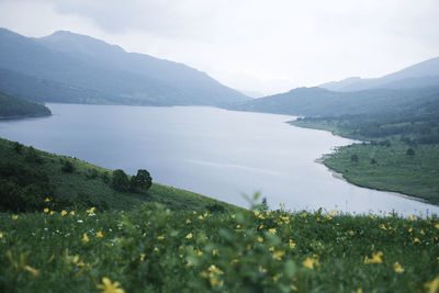Scenic view of mountains and sea against sky